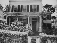 Einstein's two-story house, white frame with front porch in Greek revival style, in Princeton (112 Mercer Street).